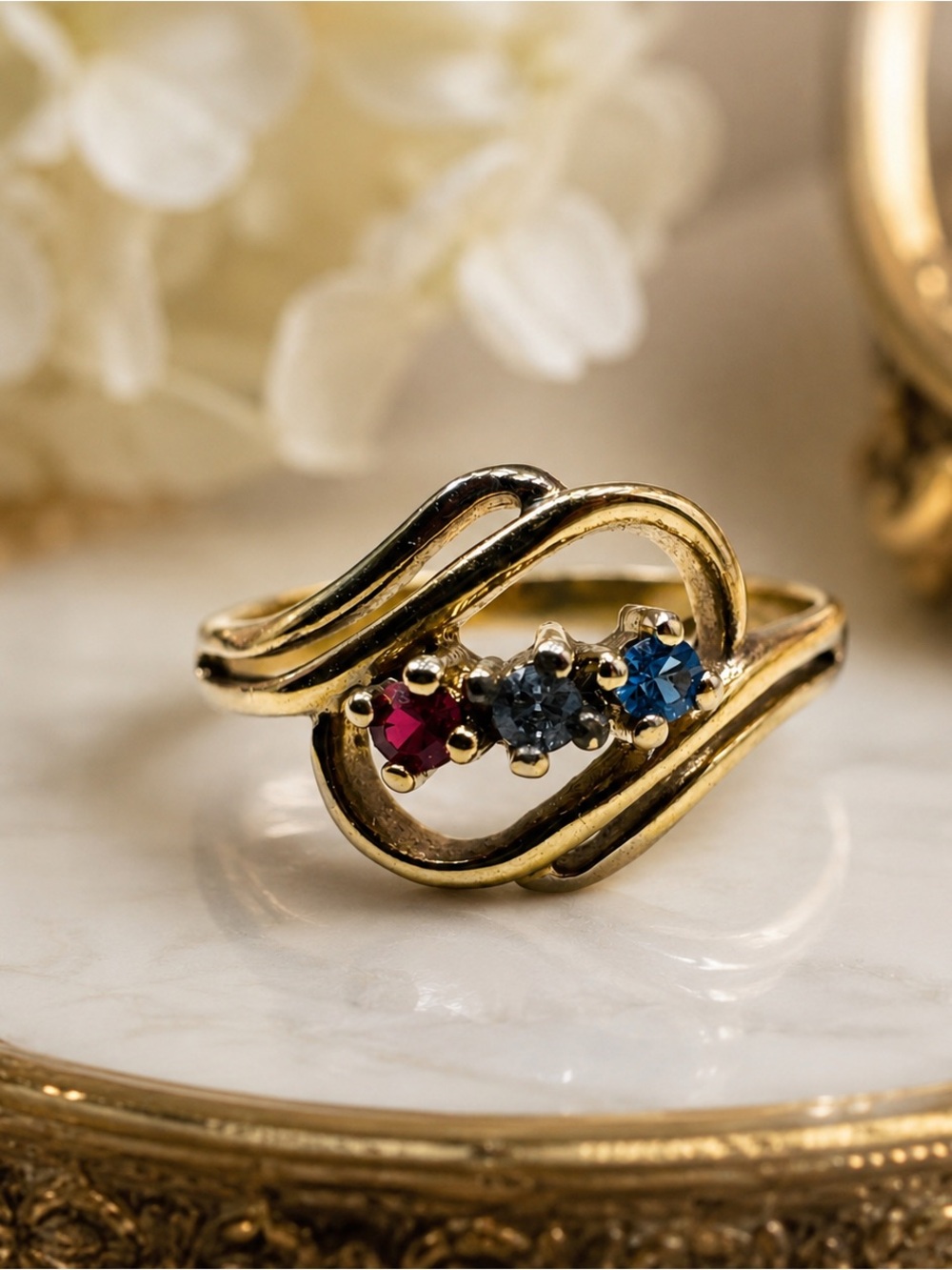 Gold Three-Stone Birthstone sample Ring with Red, Gray, and Blue Stones size 6
